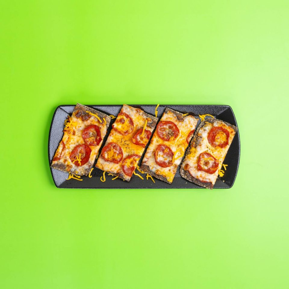 top view of baked bread with cheese and ham