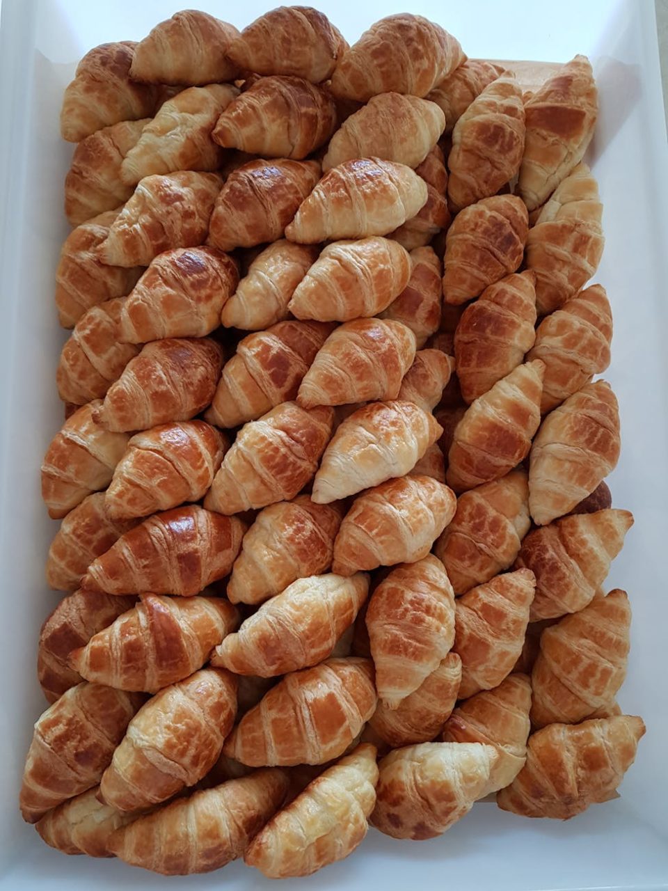 photo of croissants in white plastic container